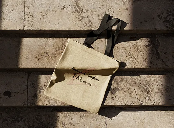 PAL Design logo printed on a natural canvas tote bag
