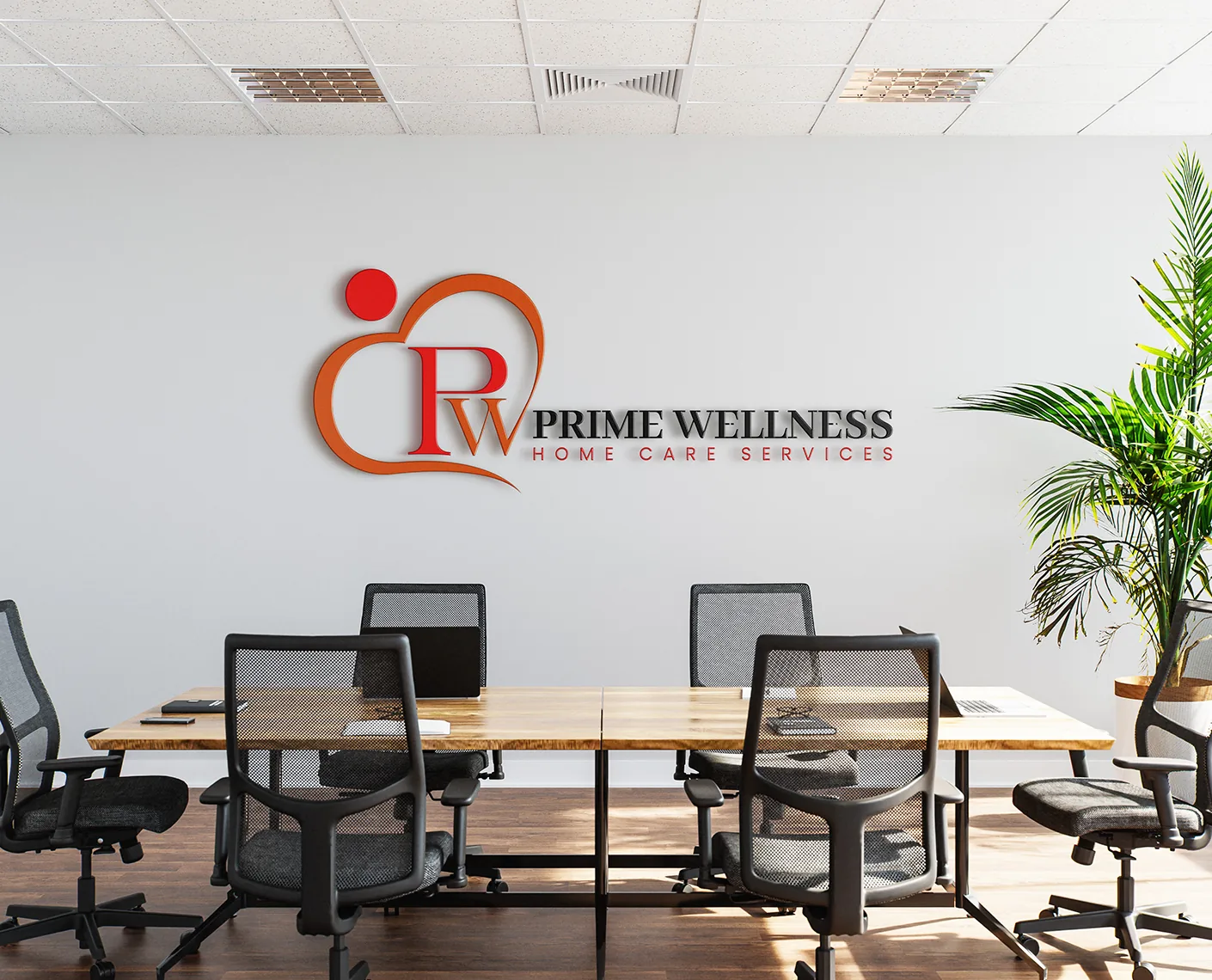 Prime Wellness logo on an office wall above a conference table