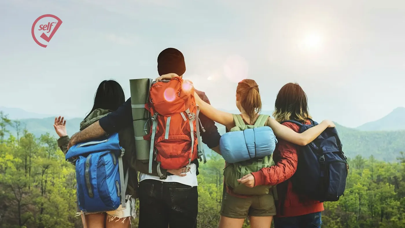 Group of hikers with backpacks, with the SelfCheck logo in the corner