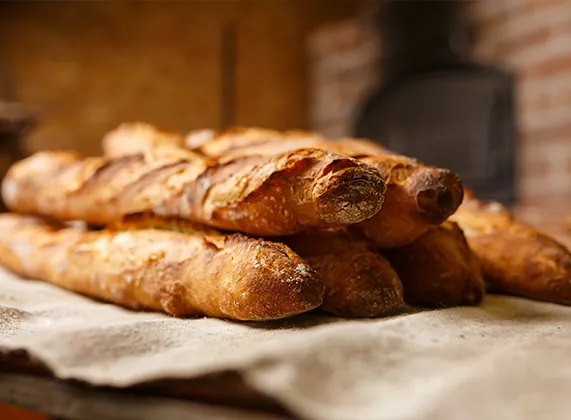 Freshly baked bread loaves on a cloth